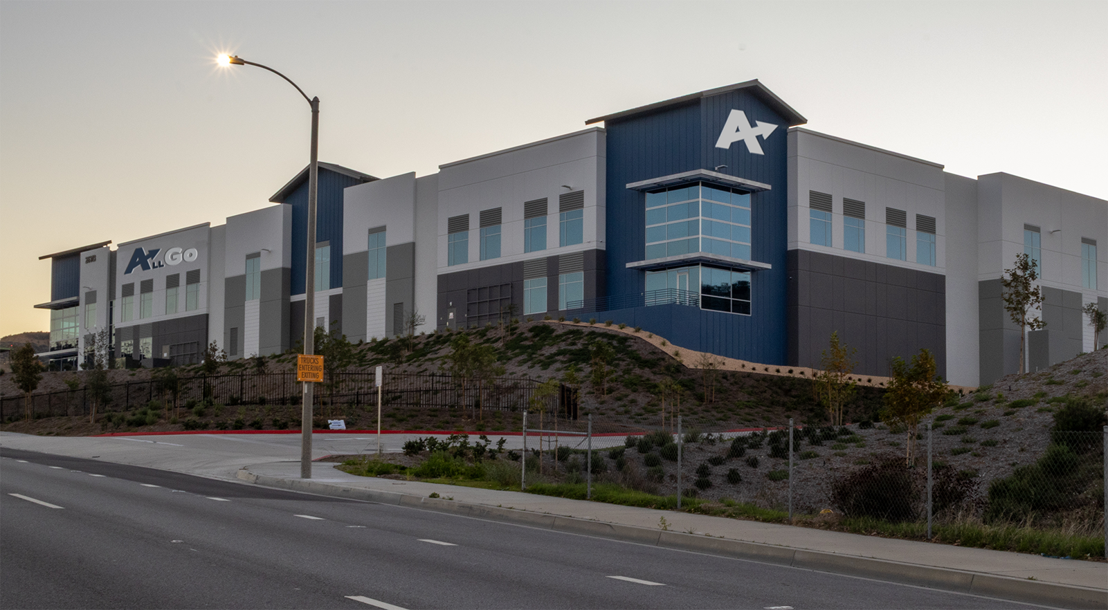 Street view of the AllGo warehouse, late afternoon