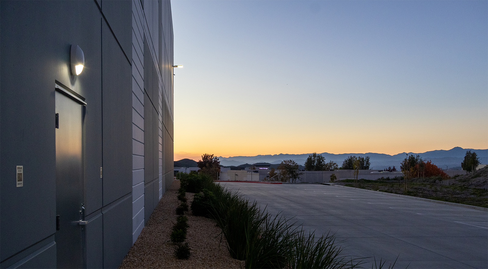 North side of the AllGo warehouse at dusk